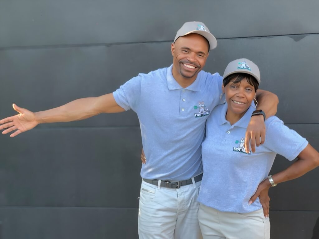 Tidy Tails Waste Solutions owners Nasceas Timms and Bessie Taylor in uniform providing professional dog waste removal service in Atlanta Georgia